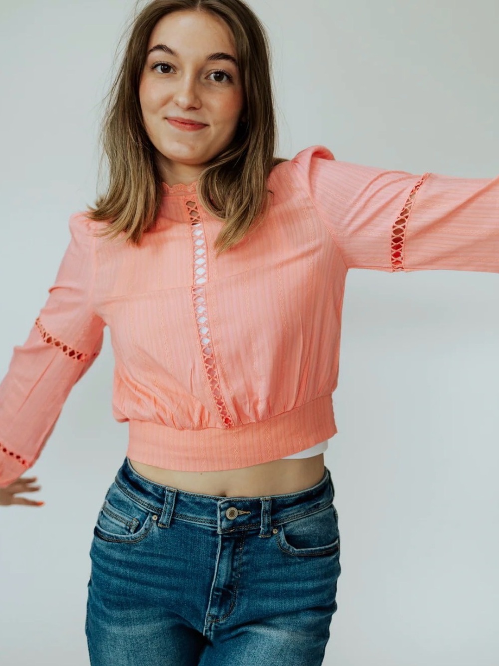 Pink long sleeved cropped top.